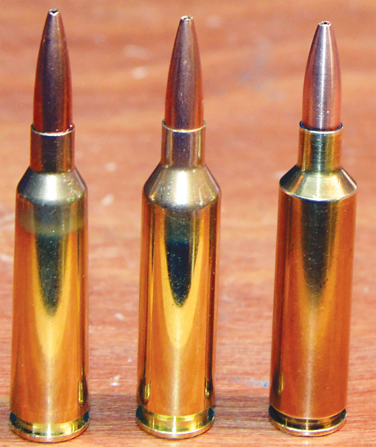 These cartridges are positioned according to gross water capacity. The 22-250 (Lapua case) at left held 44.3 grains, the 22 Creedmoor (Peterson case) in the center held 49.3 grains and the 22 Ackley Improved (Federal fireformed case) at right held 50.2 grains. Despite those differences, there is not a lot of difference in their maximum velocities.